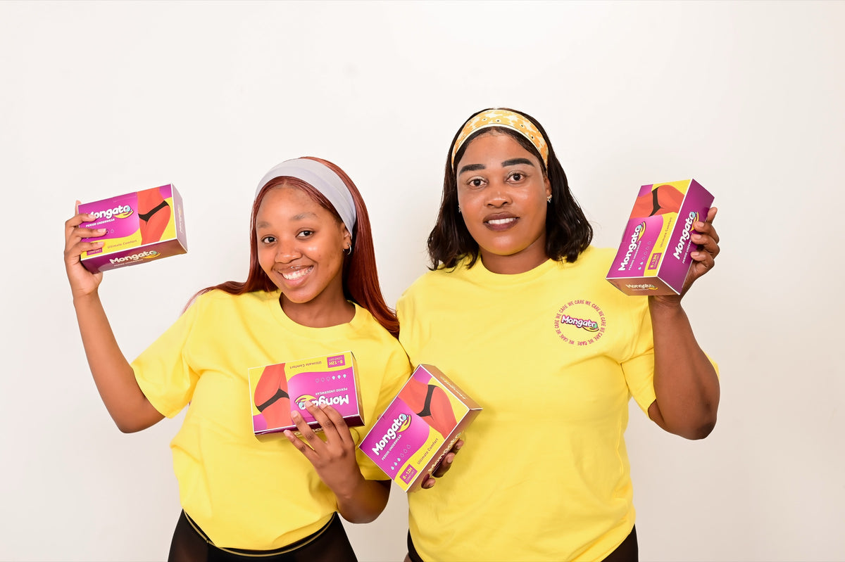 Two women in Mongato T-shirts holding Mongato period underwear boxes