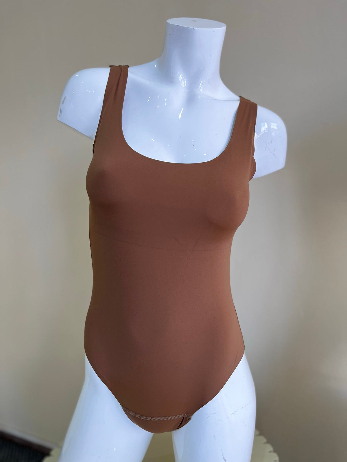 Mongato Swim one-piece in Brown on a mannequin