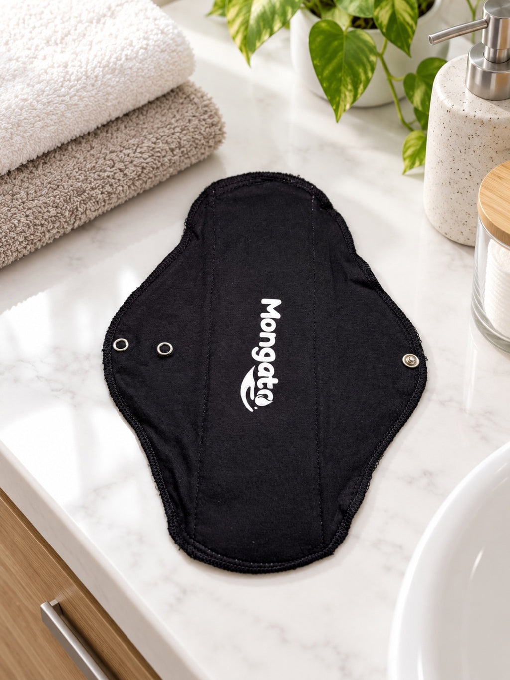 Mongato Basic Pad reusable pad on a bathroom counter